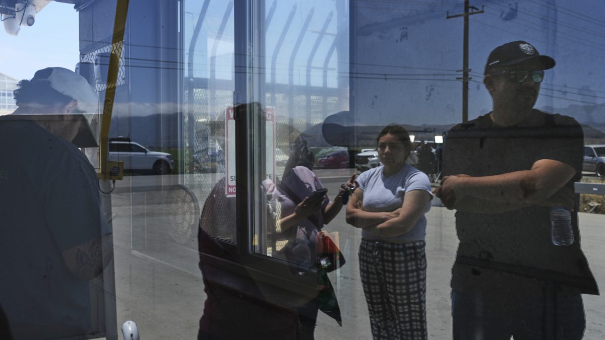 People wait outside of Glass House Farms, a day after an immigration raid on the facility, Friday, July 11, 2025, in Camarillo, Calif. AP People wait outside of Glass House Farms, a day after an immigration raid on the facility, Friday, July 11, 2025, in Camarillo, Calif. AP