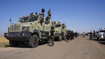 Syrian government security forces gather on the outskirts of Sweida province where clashes erupted between Druze militias and Sunni Bedouin clans, southern Syria. AP