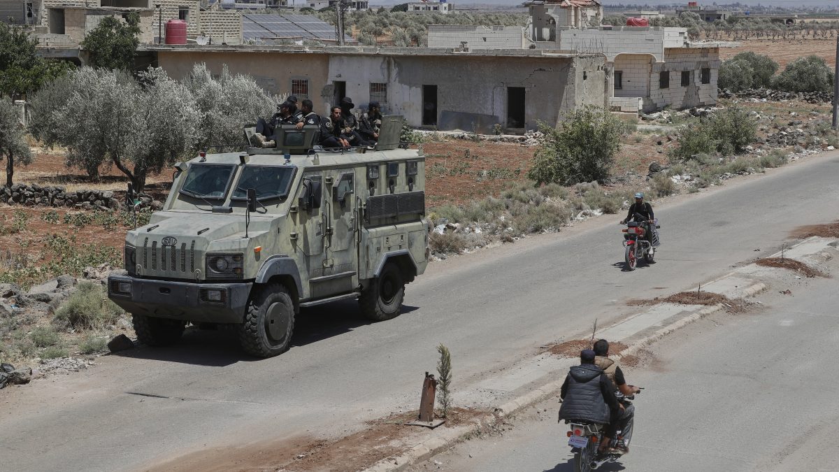 Syrian government security forces sit on their armored vehicle at Busra al-Harir village in Daraa, as they prepare to enter Sweida province where clashes erupted between Druze militias and Sunni Bedouin clans, southern Syria. AP Syrian government security forces sit on their armored vehicle at Busra al-Harir village in Daraa, as they prepare to enter Sweida province where clashes erupted between Druze militias and Sunni Bedouin clans, southern Syria. AP