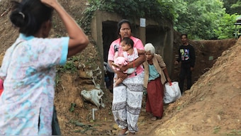 Thai people who fled clashes between Thai and Cambodian soldiers take shelter in Surin province, northeastern Thailand, Thursday, July 24, 2025. (AP Photo/Sunny Chittawil)