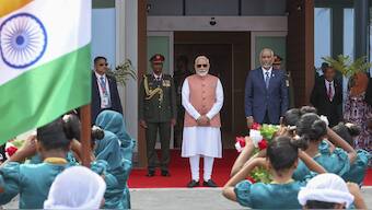Indian Prime Minister Narendra Modi, center, and Maldives President Mohamed Muizzu, center right, watch a traditional welcome dance upon Modi's arrival at the airport, on Friday, Male, Maldives. AP