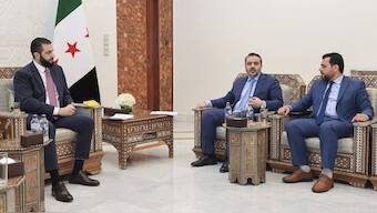In this photo released by the Syrian official news agency SANA, Syria's interim President Ahmad al-Sharaa, left, meets with Syria's Foreign Minister Asaad al-Shibani, center, and Mohammed Taha al-Ahmad, chairman of the Higher Committee for People's Assembly Elections, right, in Damascus, Syria. AP