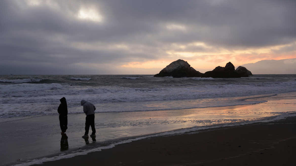During a tsunami advisory triggered by an underwater earthquake off the coast of Russia, Gaby Lazlo and Daniel Ramirez visit Ocean Beach in San Francisco on Tuesday. Scott Strazzante/San Francisco Chronicle via AP During a tsunami advisory triggered by an underwater earthquake off the coast of Russia, Gaby Lazlo and Daniel Ramirez visit Ocean Beach in San Francisco on Tuesday. Scott Strazzante/San Francisco Chronicle via AP