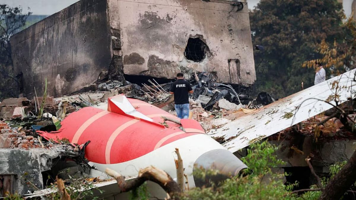 A part of the Air India plane near the medical hostel it crashed into in Ahmedabad. File image/PTI A part of the Air India plane near the medical hostel it crashed into in Ahmedabad. File image/PTI