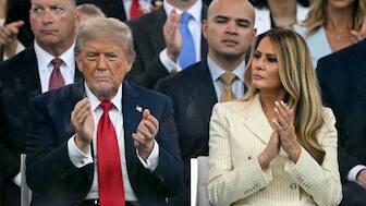 US President Donald Trump (left) and US First Lady Melania Trump (right) applaud as they watch the Army 250th Anniversary Parade from the Ellipse in Washington DC on June 14, 2025. (Photo: Mandel Ngan/AFP)
