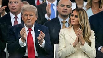 US President Donald Trump (left) and US First Lady Melania Trump (right) applaud as they watch the Army 250th Anniversary Parade from the Ellipse in Washington DC on June 14, 2025. (Photo: Mandel Ngan/AFP)
