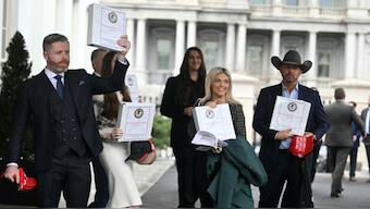 (From Left) Political commentator Rogan O'Handley, aka DC Draino; TikToker Chaya Raichik; US conservative activist Scott Presler; commentator Liz Wheeler; and US conservative political commentator Chad Prather carry binders bearing the seal of the US Justice Department reading 'The Epstein Files: Phase 1' as they walk out of the West Wing of the White House in Washington, DC, on February 27, 2025. (Photo: Jim Watson/AFP)