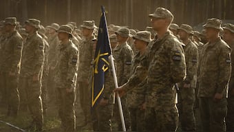 Newly recruited soldiers attend a ceremony as they celebrate the end of their training at a military base close to Kyiv, Ukraine, Monday, Sept. 25, 2023. (AP Photo/Efrem Lukatsky)