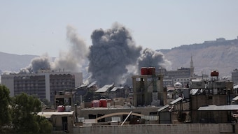Smoke rises after strikes on Syria's defense ministry in Damascus, according to Al Jazeera TV, in Damascus, Syria July 16, 2025. REUTERS/Khalil Ashawi