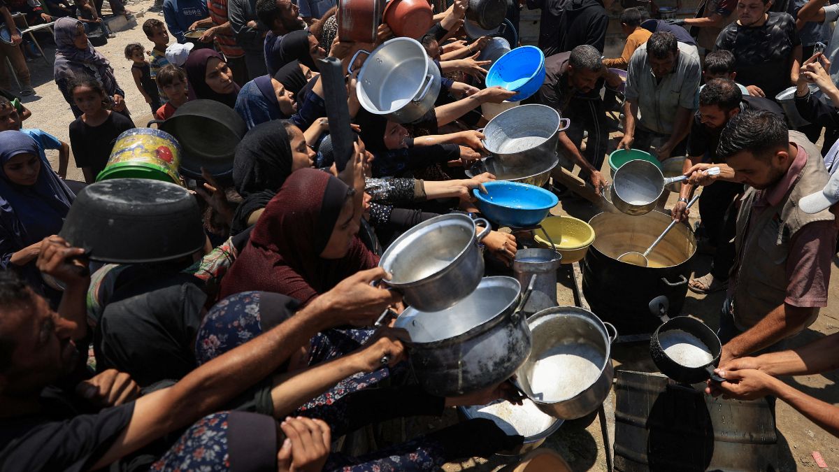 Palestinians gather to receive food from a charity kitchen, amid a hunger crisis, in Gaza City. File Image/Reuters Palestinians gather to receive food from a charity kitchen, amid a hunger crisis, in Gaza City. File Image/Reuters