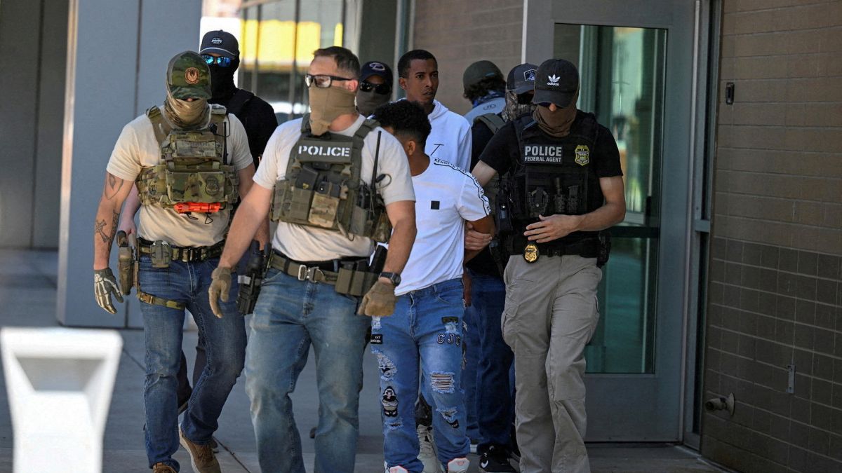 Law enforcement officers, including HSI and ICE agents, take people into custody at an immigration court in Phoenix, Arizona, US, May 21, 2025. File Image/Reuters Law enforcement officers, including HSI and ICE agents, take people into custody at an immigration court in Phoenix, Arizona, US, May 21, 2025. File Image/Reuters