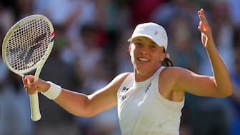 Five-time Grand Slam champion Iga Swiatek celebrates after defeating Belinda Bencic to reach her maiden Wimbledon final at the Centre Court on Thursday, 10 July. AP