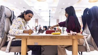Grandmaster Koneru Humpy and International Master Divya Deshmukh in action during the all-Indian final of the 2025 FIDE Women's World Cup in Batumi, Georgia. Image: FIDE