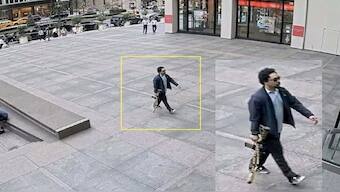 A man holding a rifle walks into an office building at 345 Park Avenue shortly before a shooting that killed several people, in the Midtown Manhattan district of New York City, US on Monday, in a still image taken from surveillance video. Reuters
