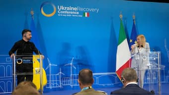 Ukraine's President Volodymyr Zelenskyy and Italian Prime Minister Giorgia Meloni speak with media reporters during the Ukraine Recovery Conference at La Nuvola convention center in Rome, Thursday, July 10, 2025. (AP Photo)