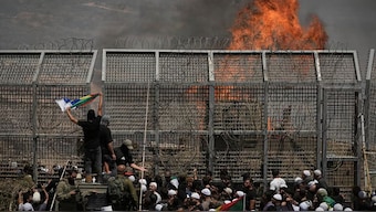 Druze from Syria and Israel protest on the Israeli-Syrian border, in Majdal Shams in the Israeli-controlled Golan Heights, Wednesday, July 16, 2025, amid the ongoing clashes between Syrian government forces and Druze armed groups in the southern Syrian city of Sweida.Photo | AP
