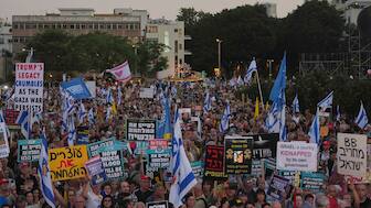People attend a rally calling for the end of the war and the immediate release of hostages held by Hamas in the Gaza Strip, as they gather in Tel Aviv, Israel, Thursday, July 24, 2025. (AP Photo)