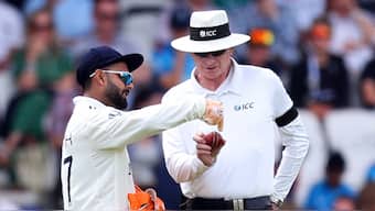 India wicketkeeper Rishabh Pant has a discussion with umpire Paul Reiffel during the first Test against England at Headingley, Leeds. Reuters