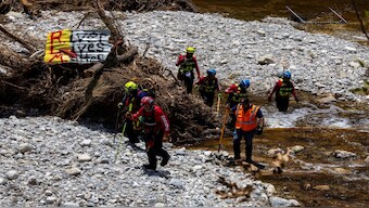 Search and rescue team members look for missing people amid debris in the waters of the Guadalupe River, near Camp Mystic, following deadly flooding, in Hunt, Texas, US, on Thursday. Reuters File