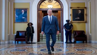 Senate Majority Leader John Thune, R-S.D., leaves the chamber as Republicans work on a final push to advance President Donald Trump's tax breaks and spending cuts package, at the Capitol in Washington, on Monday. AP