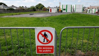 A 'No access to public' sign is put up on a barricade near the excavation site of the Tuam graveyard, where the bodies of 796 babies were uncovered at the site of a former Catholic Church-run Bon Secours Mother and Baby Home, in Tuam, Ireland, July 7, 2025. File Image/Reuters