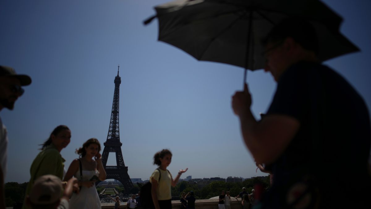 People walk at Trocadero plaza near Eiffel Tower during a heat wave, July 2, 2025 in Paris. AP People walk at Trocadero plaza near Eiffel Tower during a heat wave, July 2, 2025 in Paris. AP