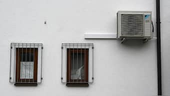 Air conditioning technology outside a building housewall, in the Bavarian village of Fuerstenfeldbruck, southern Germany on July 28, 2023. File Photo/AFP