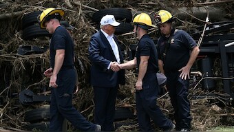 US President Donald Trump greets first responders in Kerrville, Texas, on July 11, 2025, following devastating flooding that ocurred in the area over the July 4 weekend. AFP