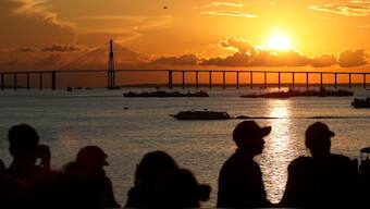 People watch the sunset over the Rio Negro in Manaus, Amazonas state, Brazil on July 6, 2025. AFP/Representational image