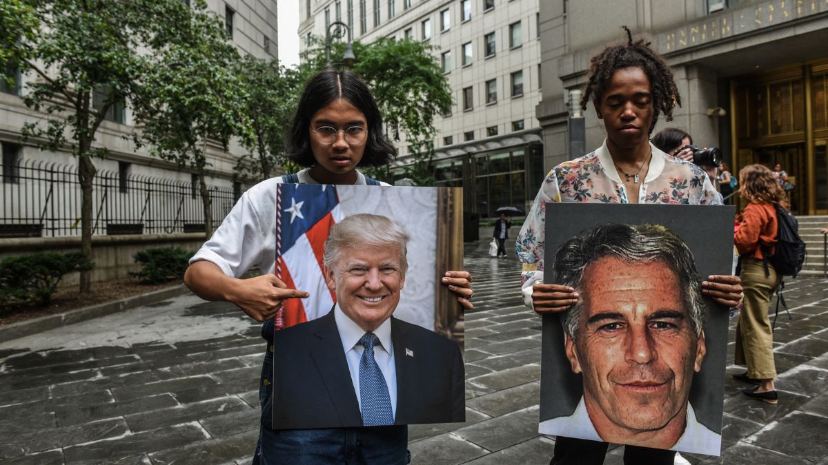 A protest group called "Hot Mess" hold up signs of Jeffrey Epstein and President Donald Trump in front of the Federal courthouse on July 8, 2019 in New York City. File Photo/AFP A protest group called "Hot Mess" hold up signs of Jeffrey Epstein and President Donald Trump in front of the Federal courthouse on July 8, 2019 in New York City. File Photo/AFP