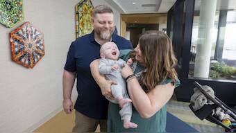 Nash Keen with his parents Mollie and Randall Keen at the  University of Iowa Health Care Stead Family Children’s Hospital in Iowa City, Iowa. AP