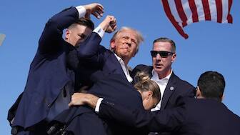 US President Donald Trump is surrounded by US Secret Service agents at a campaign rally. File image/AP