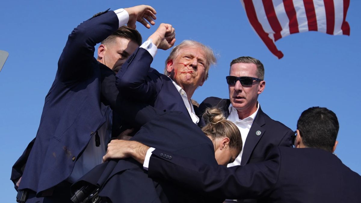 US President Donald Trump is surrounded by US Secret Service agents at a campaign rally. File image/AP US President Donald Trump is surrounded by US Secret Service agents at a campaign rally. File image/AP