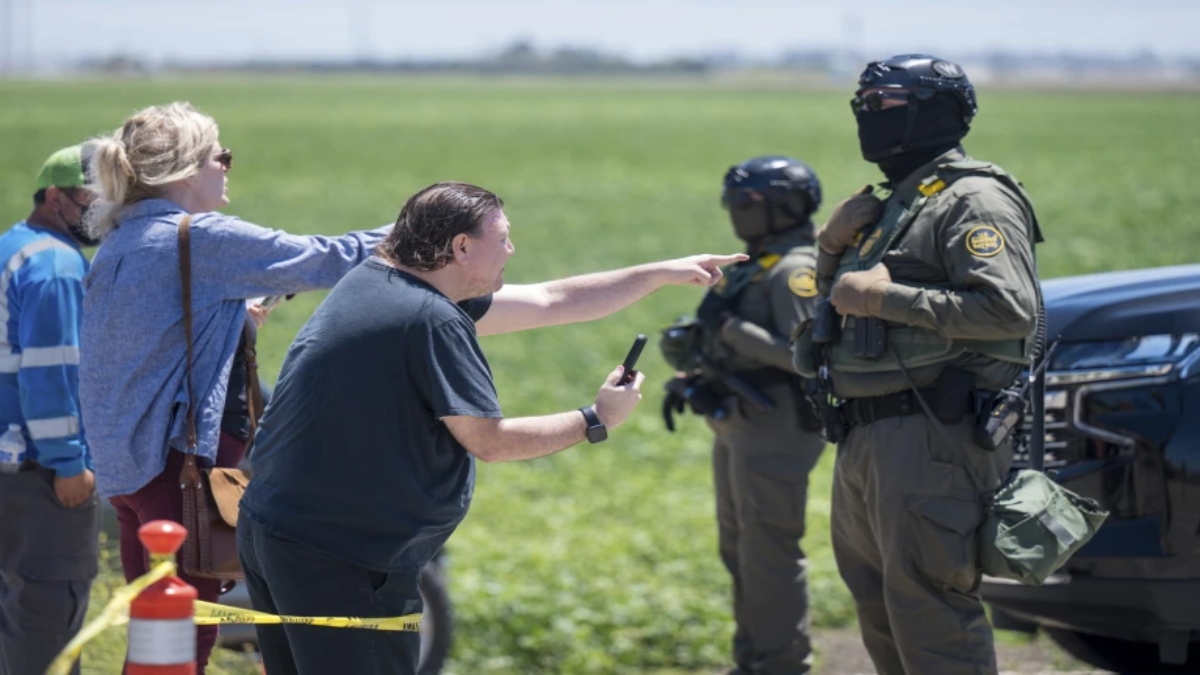 People shout at federal immigration agents during a raid in the agriculture area of Camarillo, Calif., July 10, 2025. AP People shout at federal immigration agents during a raid in the agriculture area of Camarillo, Calif., July 10, 2025. AP