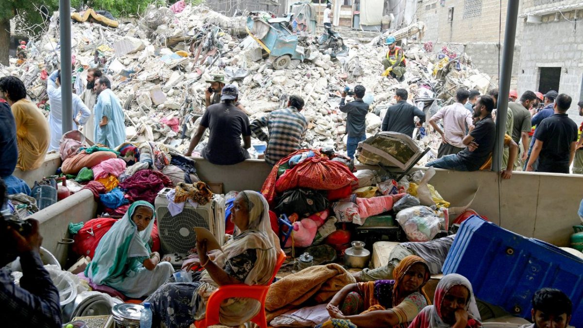 Families wait amidst the debris of a collapsed building in Karachi on July 5, 2025. Source: AFP Families wait amidst the debris of a collapsed building in Karachi on July 5, 2025. Source: AFP