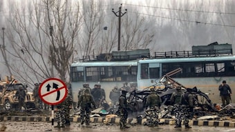 Security personnel carry out the rescue and relief works at the site of suicide bomb attack at Lathepora Awantipora in Pulwama district of south Kashmir, in February 2019. PTI