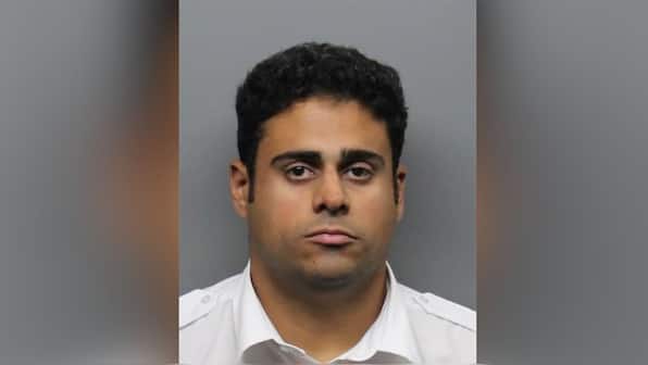 Who is the Indian-origin Delta pilot arrested from the cockpit for child sex abuse?