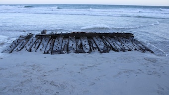 The Sanday Wreck is seen on the shores of Sanday on Orkney. The wreck was discovered in February 2024 after a storm swept away sand covering it. Wessex Archaeology via AP