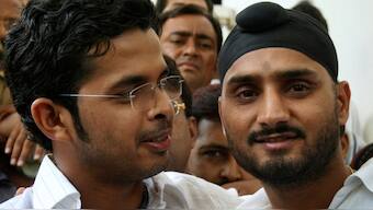 Sreesanth and Harbhajan pose after a hearing into the slapping incident during IPL 2008. Reuters