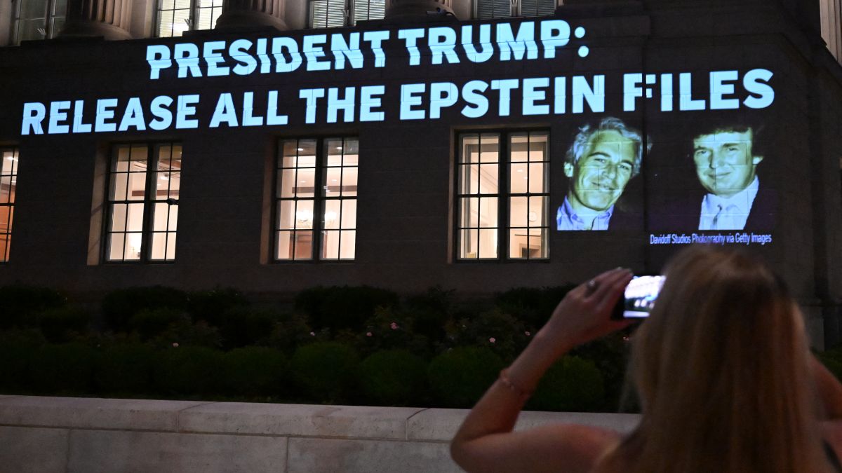 A person takes a photo as a message calling on President Donald Trump to release all files related to Jeffrey Epstein is projected onto the US Chamber of Commerce building across from the White House in Washington, DC, on July 18. AFP A person takes a photo as a message calling on President Donald Trump to release all files related to Jeffrey Epstein is projected onto the US Chamber of Commerce building across from the White House in Washington, DC, on July 18. AFP