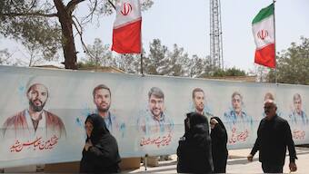 Pictures of Iranian military commanders, nuclear scientists and others killed in Israeli strikes are displayed in southern Tehran, Iran. WANA via Reuters/File Photo
