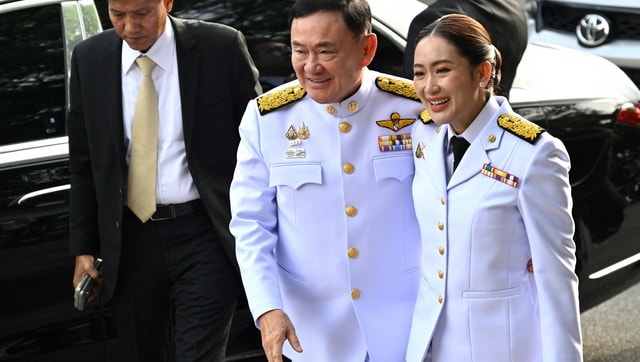 Paetongtarn Shinawatra with her father former Prime Minister Thaksin Shinawatra. Reuters