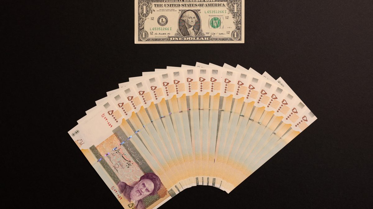 A US one dollar bill and Iranian rials are displayed. Reuters A US one dollar bill and Iranian rials are displayed. Reuters