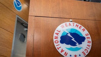The National Weather Service logo is displayed at the National Hurricane Center (NHC) during a news conference in Miami, Florida, US. Reuters