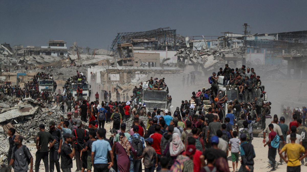 Palestinians climb onto trucks as they seek for aid supplies that entered Gaza through Israel in Beit Lahia, northern Gaza Strip. Reuters Palestinians climb onto trucks as they seek for aid supplies that entered Gaza through Israel in Beit Lahia, northern Gaza Strip. Reuters