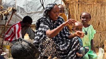 Houda Ali Mohammed, 32, a displaced Sudanese mother of four, prepares food at a camp shelter amid the ongoing conflict between the paramilitary Rapid Support Forces (RSF) and the Sudanese army, in Tawila, North Darfur, Sudan. Reuters