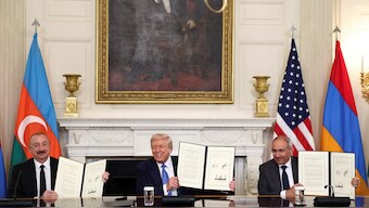 US President Donald Trump, Azerbaijan's President Ilham Aliyev, and Armenia's Prime Minister Nikol Pashinyan pose with their documents during a trilateral signing event at the White House, in Washington, DC. Reuters