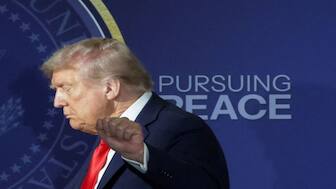 US President Donald Trump gestures as he walks off stage following a press conference with Russian President Vladimir Putin. Reuters