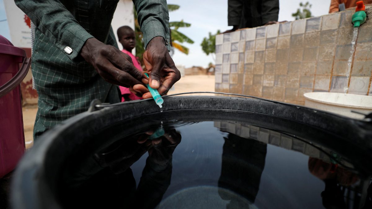 A community health worker adds chlorine to water while internally displaced people gather to fill their buckets at the water point in Muna Garage IDP camp in Maiduguri, Borno State, Nigeria. File image/ Reuters A community health worker adds chlorine to water while internally displaced people gather to fill their buckets at the water point in Muna Garage IDP camp in Maiduguri, Borno State, Nigeria. File image/ Reuters