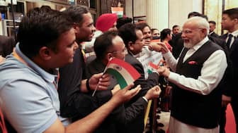 India's Prime Minister Modi is welcomed by the Indian community in Tianjin.  Reuters